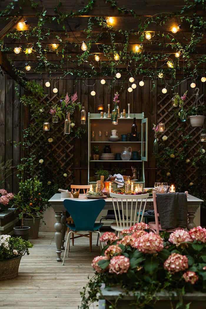 Varying String Lights Add Whimsy To A Backyard Grotto