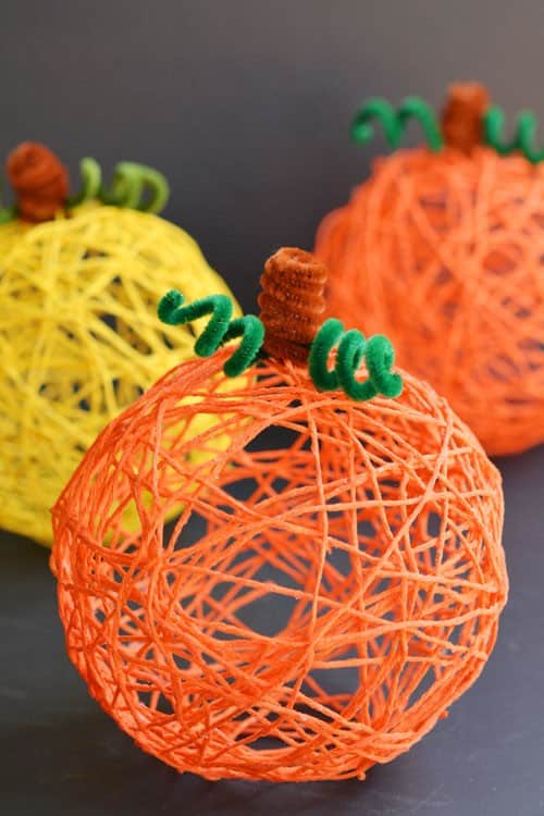 Make a Rustic Fall Display with Colorful Yarn Pumpkins