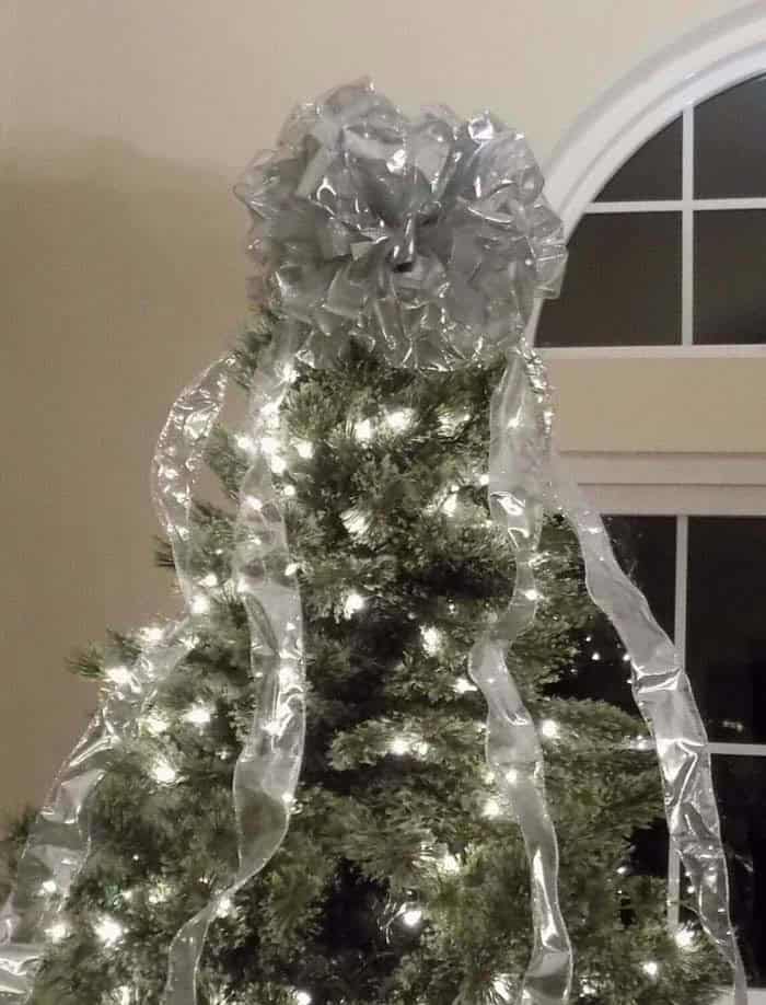 Create a Festive Statement with a Silver Bow Tree Topper