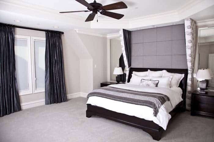 Modern Bedroom Has Black Curtains, Oversized Headboard