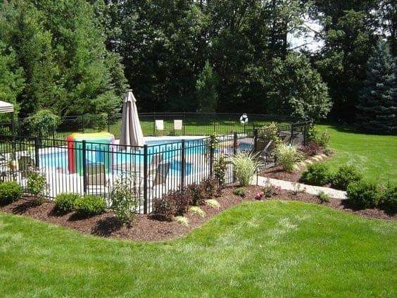 Beautify Pool Fence with Floral Surroundings and Mulch Beds