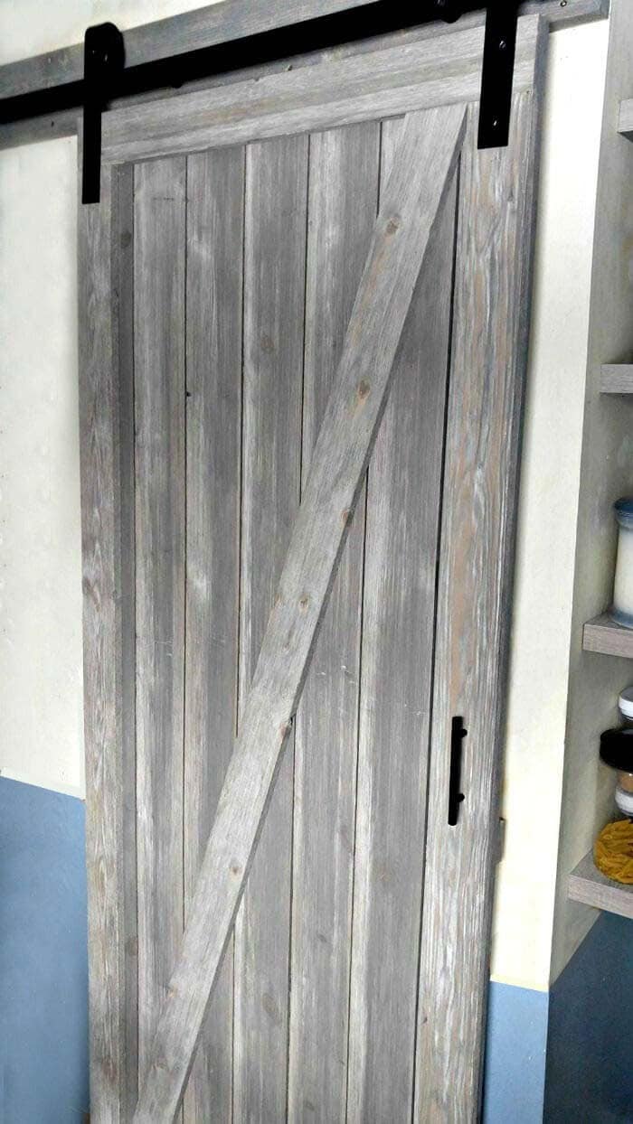 Pantry With a Classic Barnwood Door