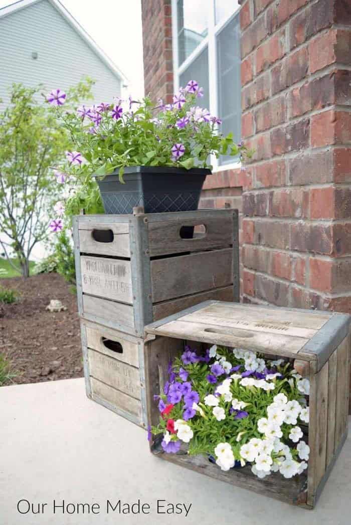 Playful Porch Decor Idea with Stacked Crates and Flowers