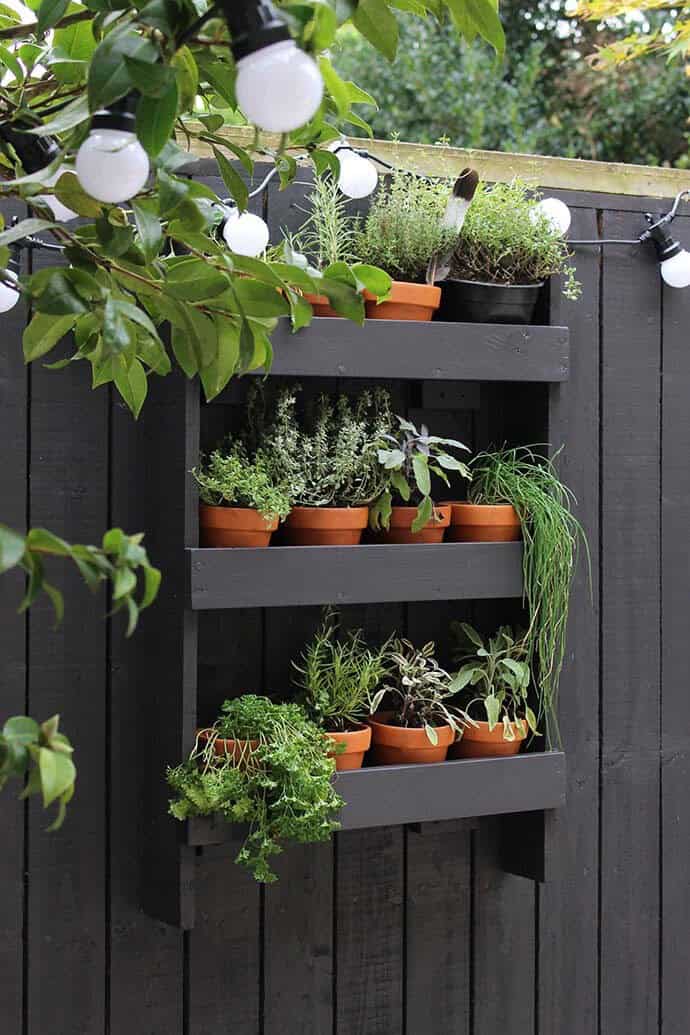 Fence Mounted Shelves Hold Your Garden