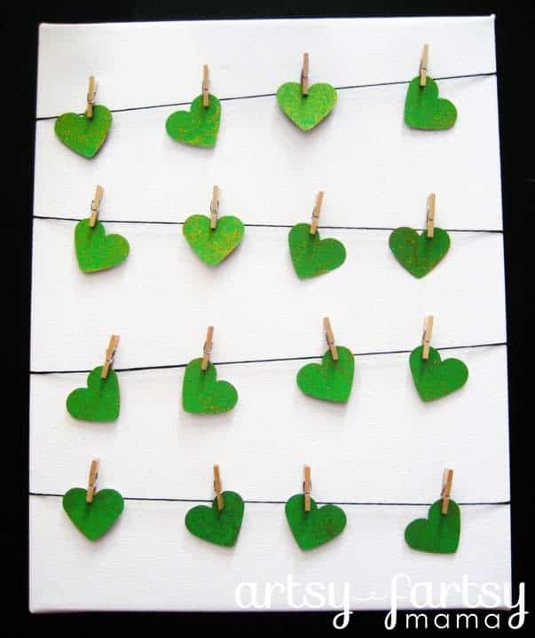 String Mini Green Hearts Across a Picture Frame