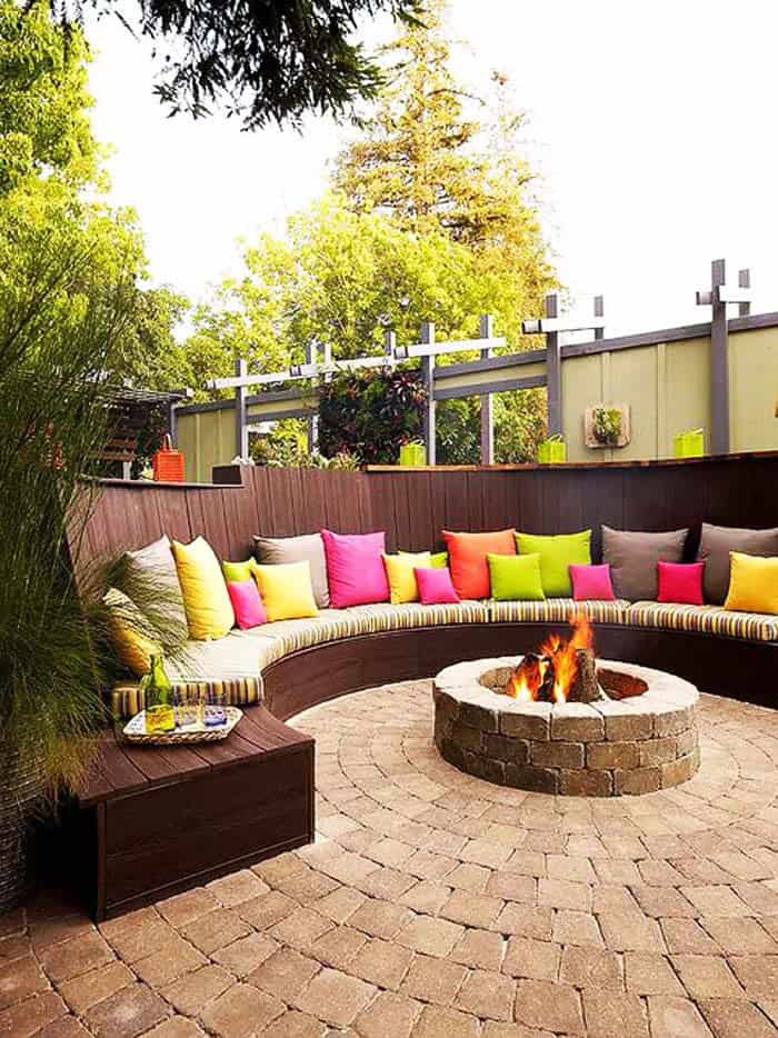 Outdoor Oasis with Curved Bench and Colorful Cushions