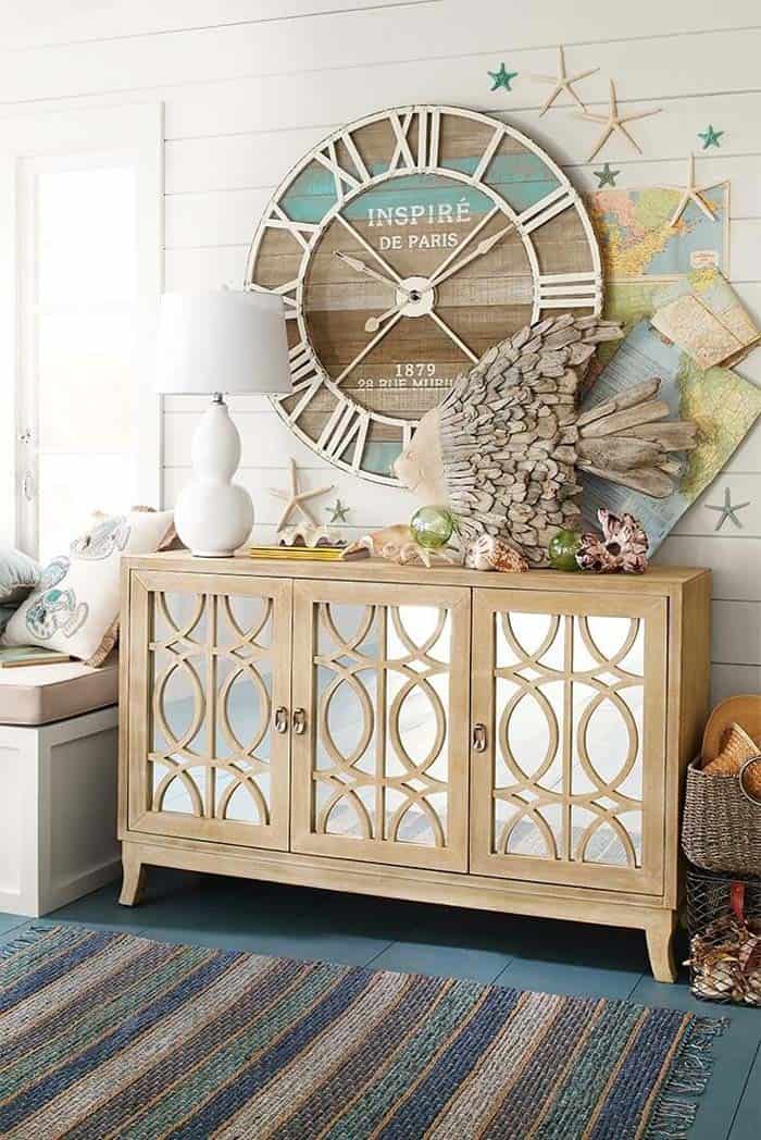 Coastal Look with Wooden Clocks, Fish Statues and Seashells