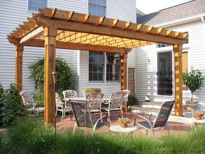 Pergola Over White Wrought Iron Patio Set