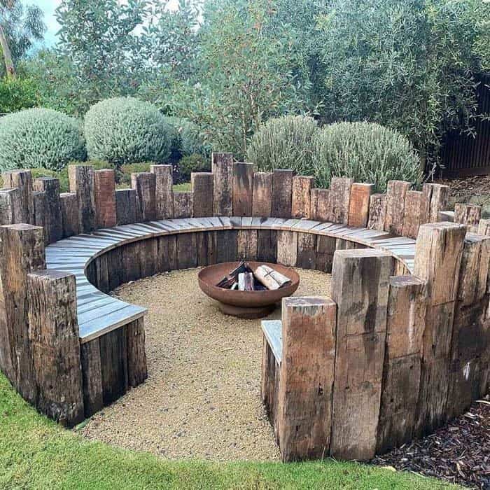 Impress Guests with Rustic Wood-Post Fire Pit Bench Seating