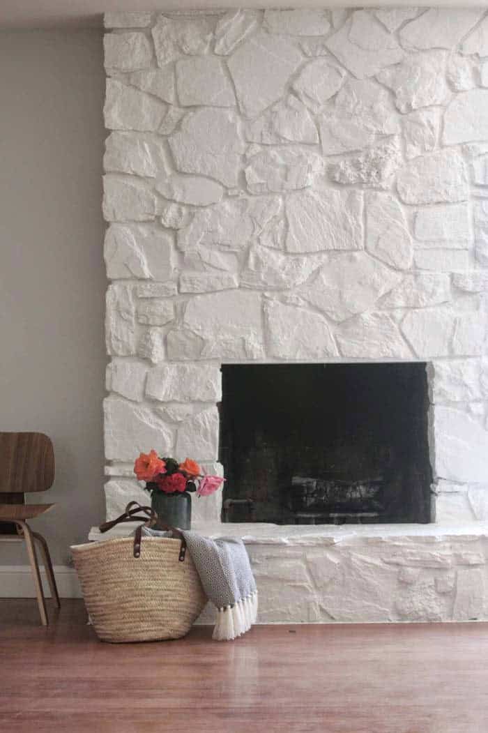 Add a Touch of Elegance with Painted White Stone Fireplace