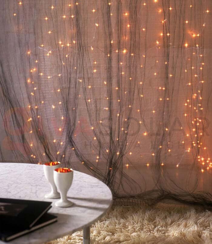 Use a Neutral Curtain Backdrop for Your Lights