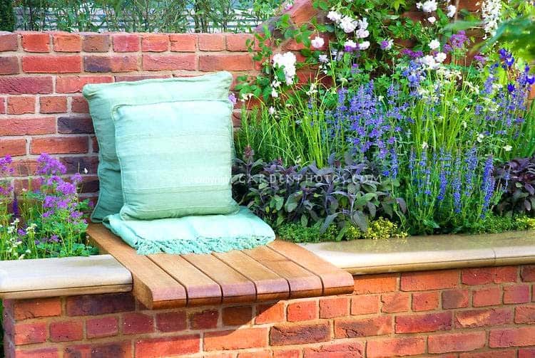 Enjoy Nature with a Bench on a Brick Flower Bed