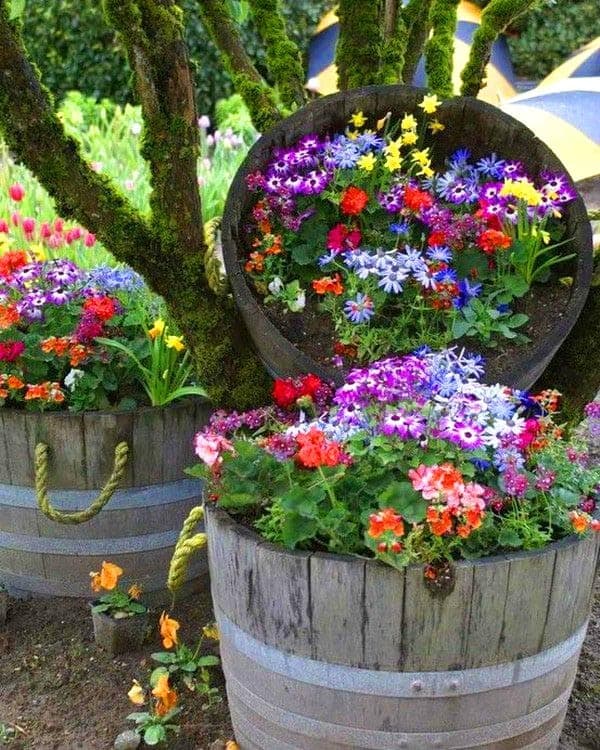 Create an Elegant Spilled Flower Display with Wine Barrels