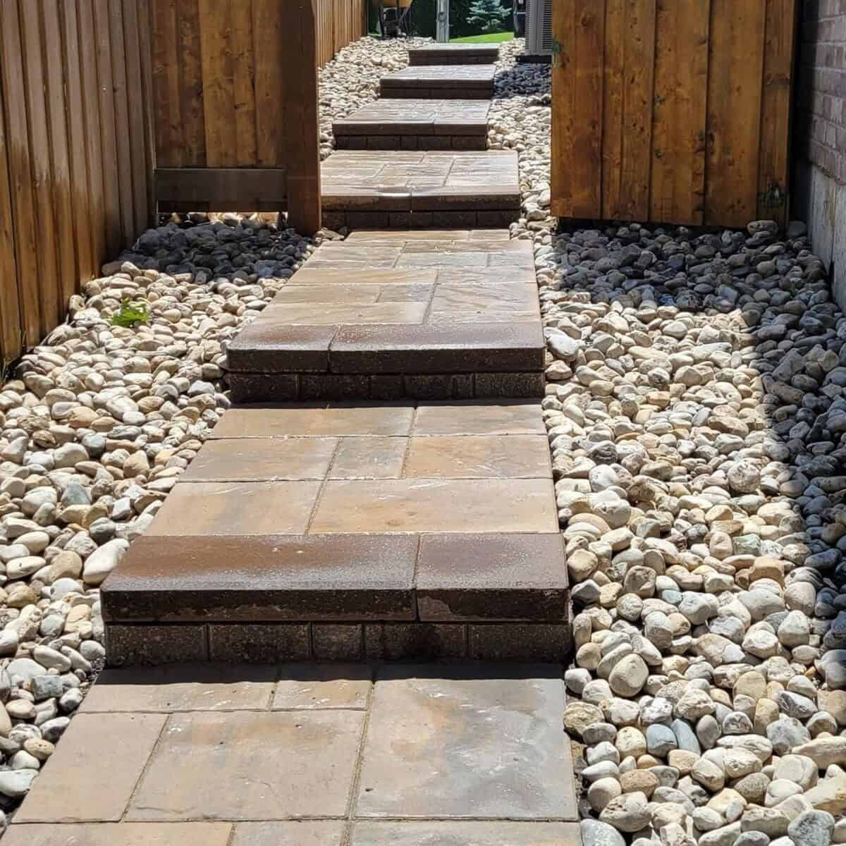 River Rocks As A Base Layer Of A Tiered Walkway