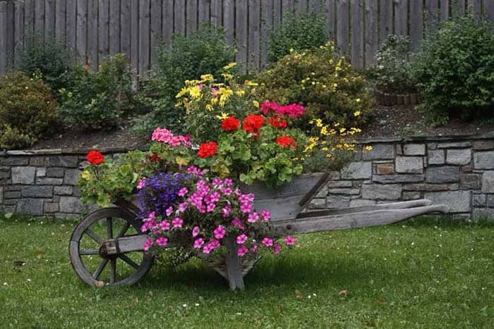 Weathered Wheelbarrow Matches Stone Wall