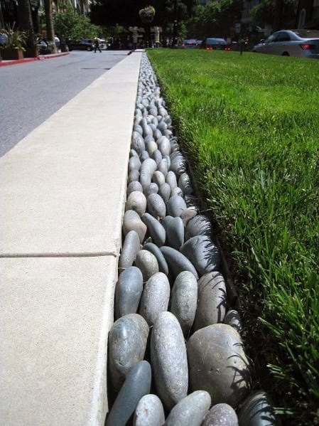 Elevate a Concrete Path with Oval-Like Granite Stones