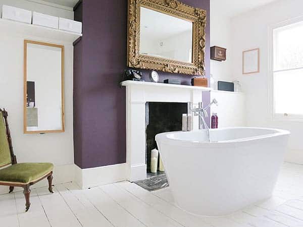 Add Style to a White Bathroom with a Purple Wall Accent