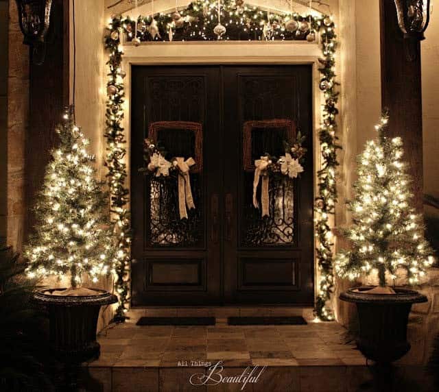 Brighten Your Porch with Lit Garland and Christmas Trees