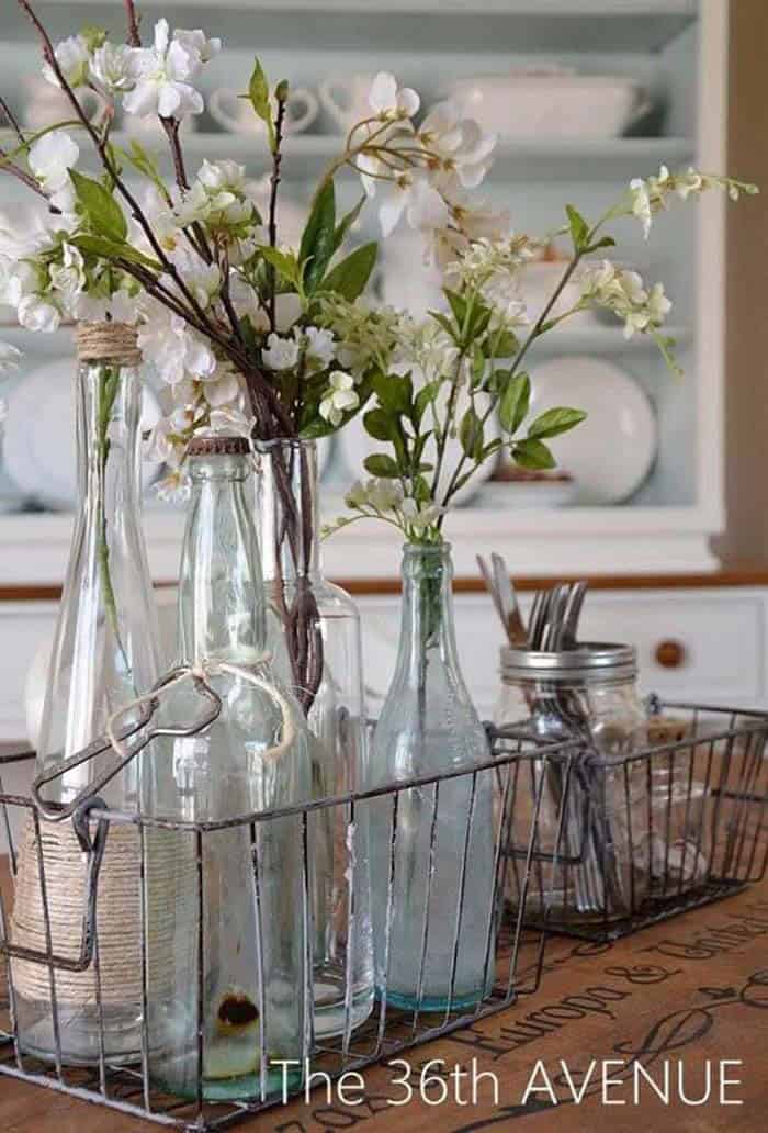 Glass Bottle Vases In Vintage Metal Baskets