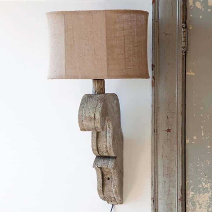 Burlap Shade Sits Atop Wood Corbel