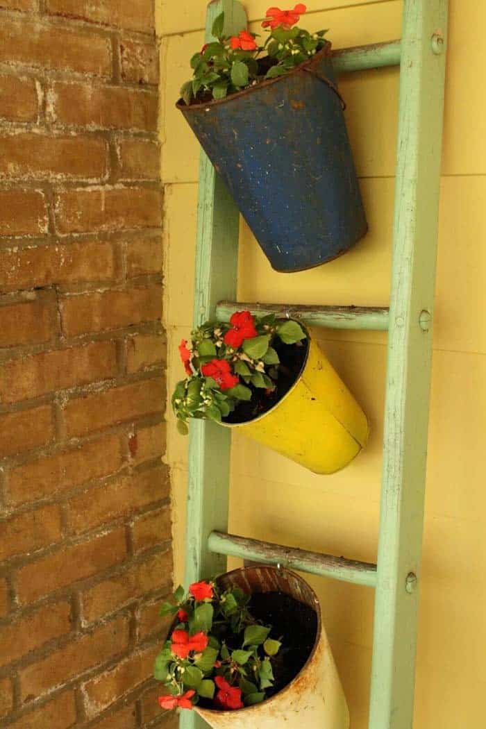 Porch with an Old Ladder and Sap Bucket Planters