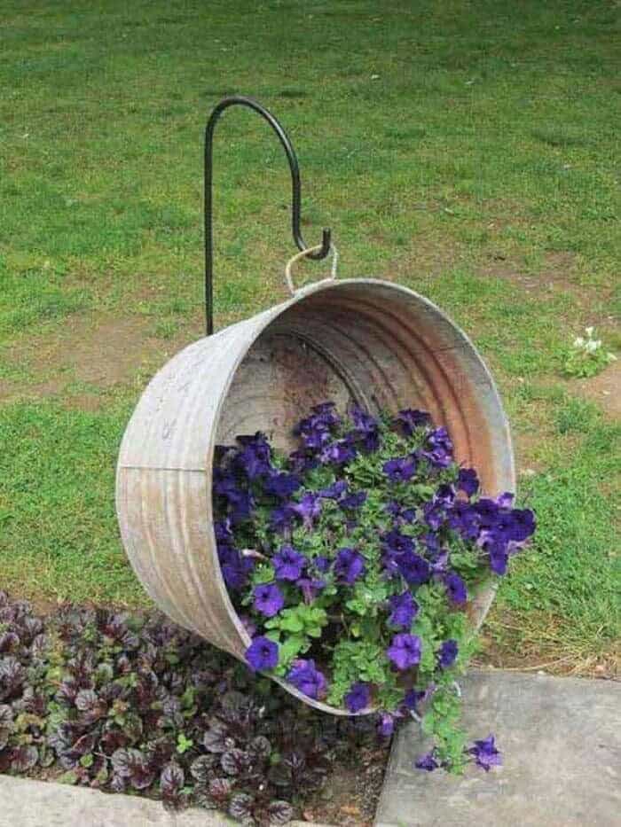 Rustic Display of Cascading Flowers in a Retro Bucket