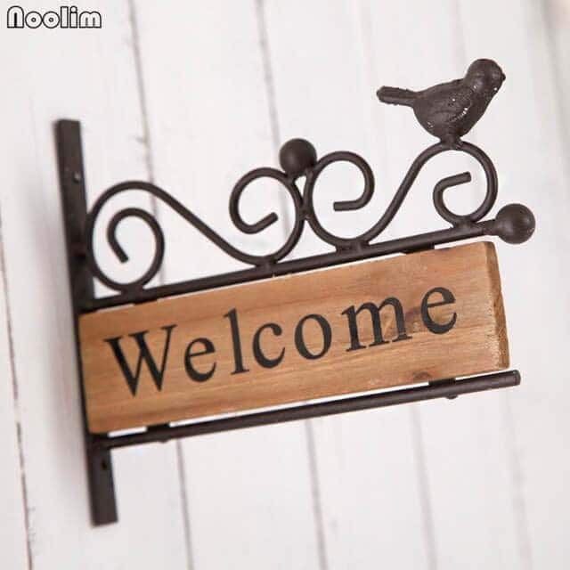 Inviting Welcome Sign with Refinement and a Bird Figure