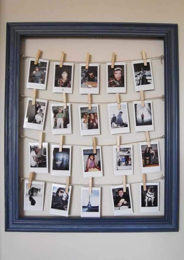 Family Photos Attached With Clothespins In A Frame