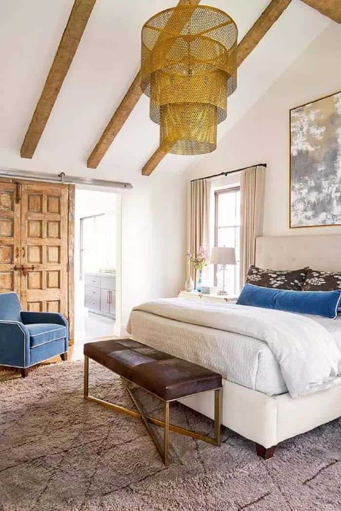 Luxurious Look in a Woman’s Bedroom with a Chandelier