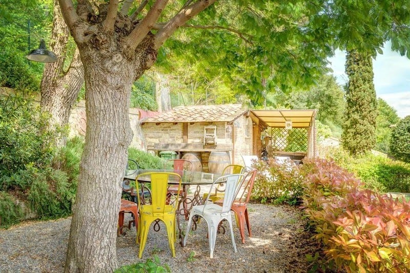 A Sitting Nook Underneath The Shade Of A Tree