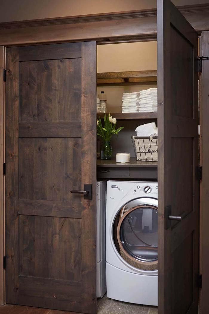 Rustic Wood Door Disguises Laundry