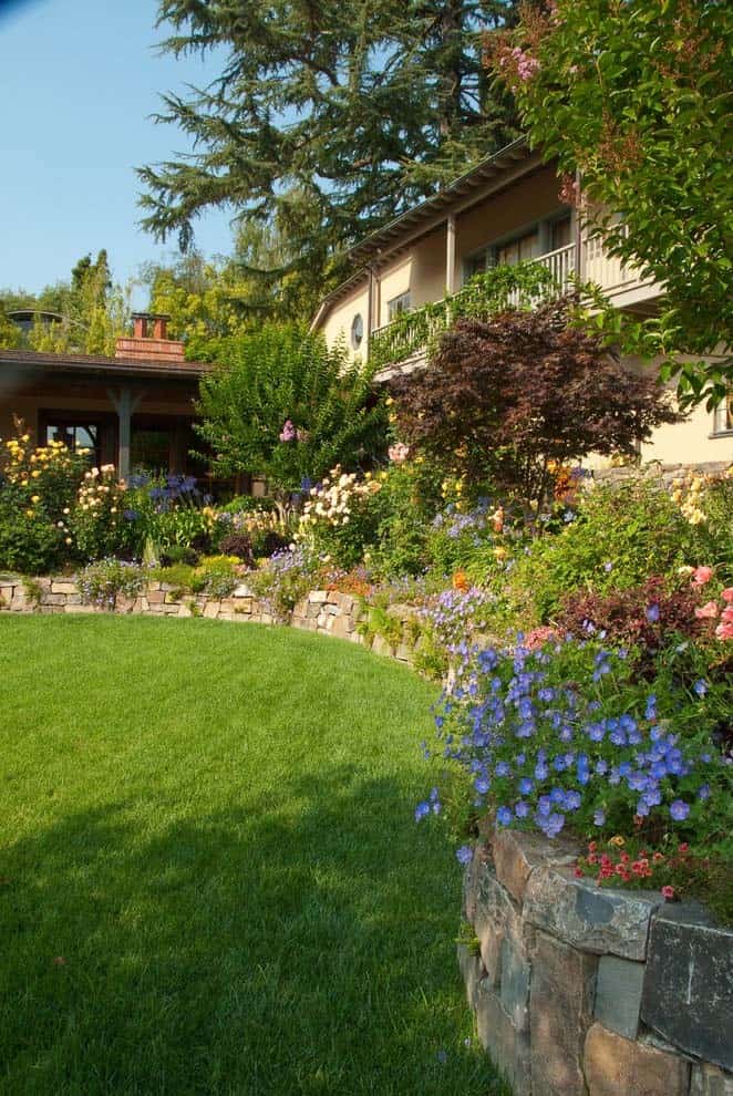 Reclaimed Bricks Create Retaining Wall for Wildflower Beds