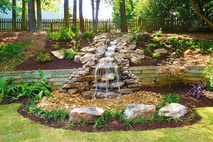 Upgrade Your Hillside with a Stunning Waterfall and Pool