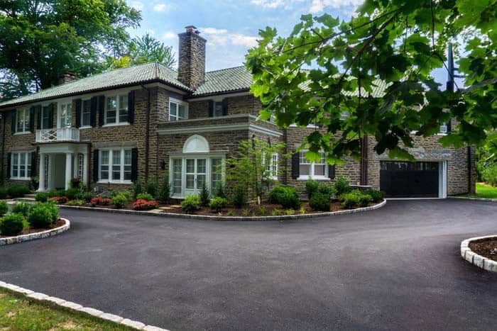 Raised Gardens and Grass Edge the Drive