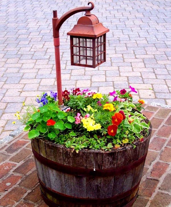 Light Up Your Wine Barrel Planter with a Rustic Lantern