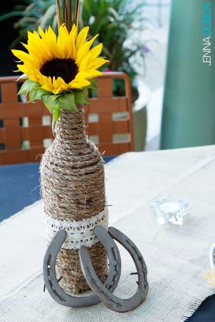 A Rustic Wrap Of A Bottle With A Sunflower