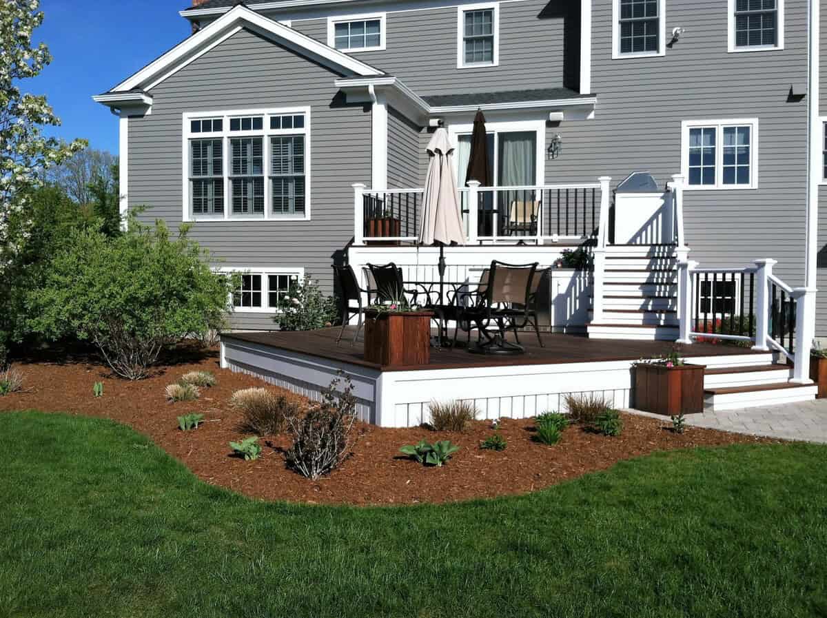 Tiered Deck Surrounded By A Garden