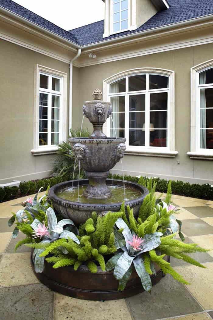 Stone Fountain Surrounded by Bromeliads