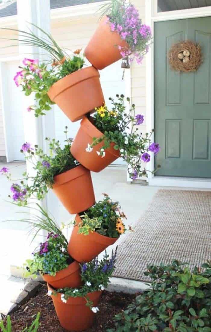 Colorful Vertical Garden with Terra Cotta Planters and Rebar