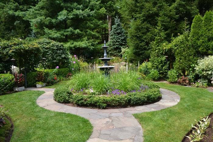 Tall Ornamental Grasses Hide Fountain