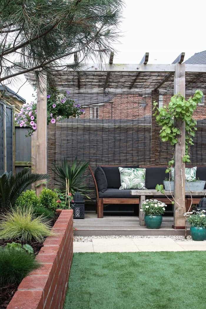 Cozy Garden Getaway with a Pergola and Raised Flower Bed