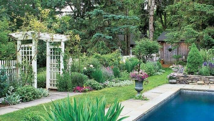 Elevate Outdoors with a Stunning Arbor and Lush Greenery