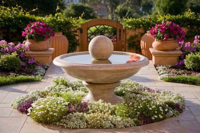 Fountain and Flower Bed Brings Mediterranean Vibe