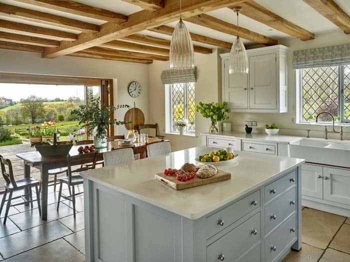 Exposed Beams On The Ceiling Of A Rustic Country Kitchen