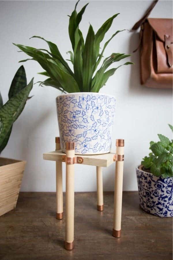 Copper Accents Highlight A Wood Stand