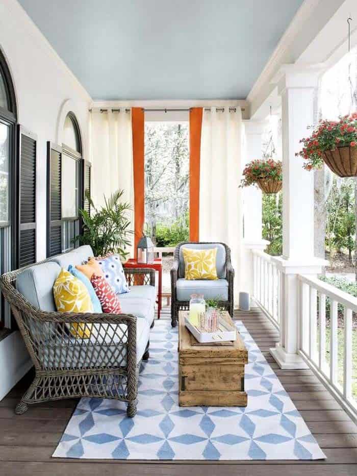 Porch with Wicker Furniture, Blue, and Orange Accents