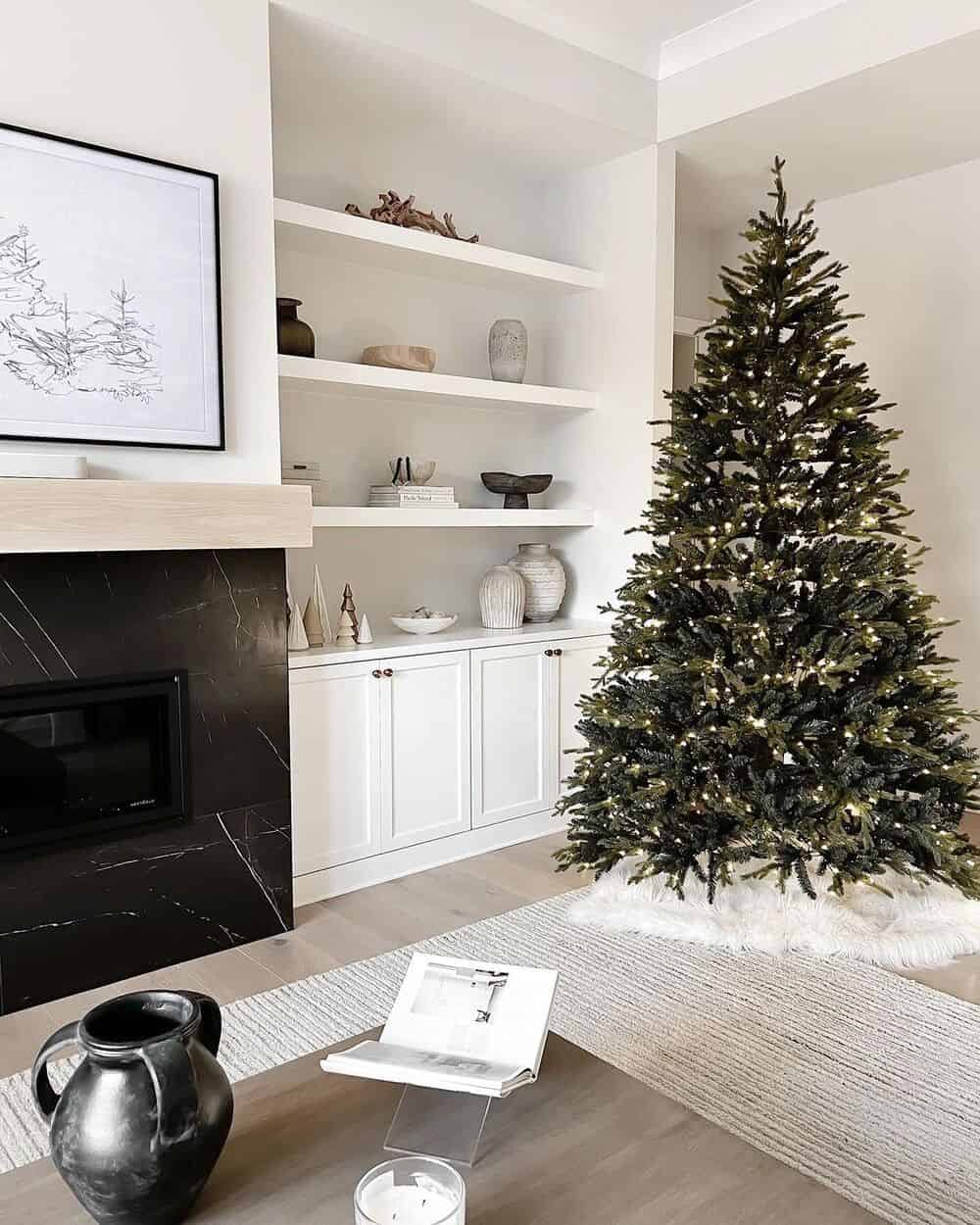 Black Fireplace And A Light Christmas Tree