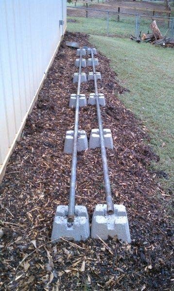 Build DIY Firewood Rack With Concrete Footings