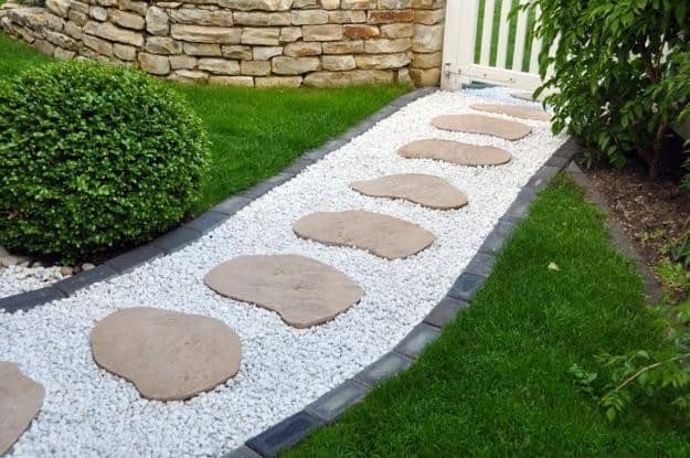 Stone pathway laid over white pebbles