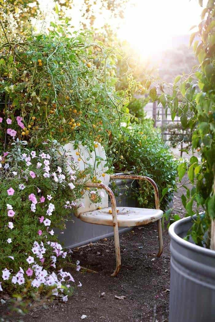 Take Comfort in Nature with a Vintage Seat Under Greenery